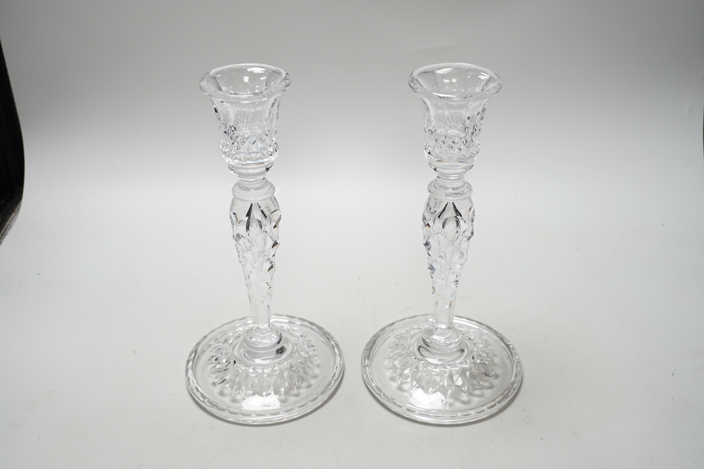 A pair of cut glass candlesticks, 25cm high